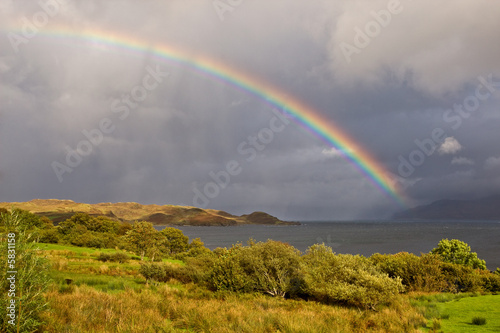 Rainbow above the lake with dramatic sky, Isle of Skye, Scotland