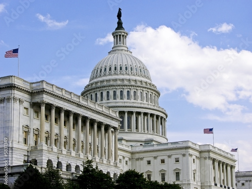 US Capitol Building with 3 Flags Flying photo