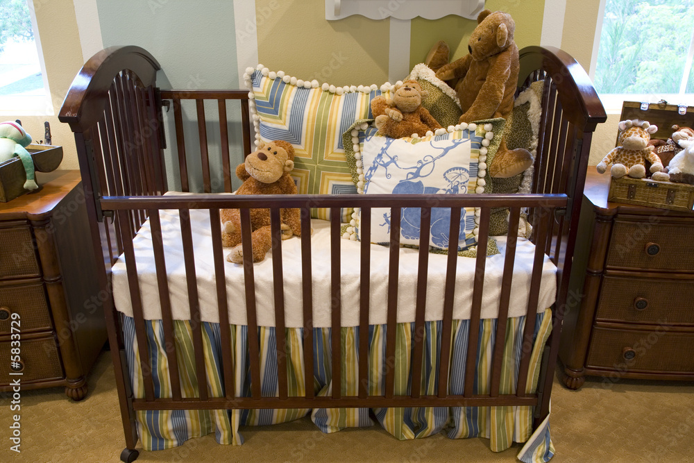 Baby bedroom with a crib, toys and decor.