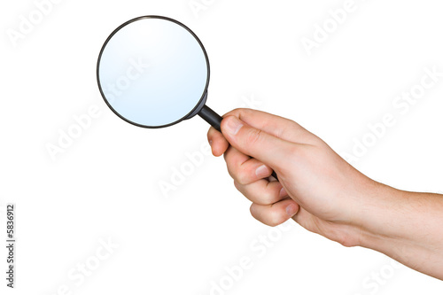 Magnifying glass in hand, isolated on white background