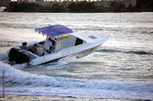 Motor Boat With Blue Canopy