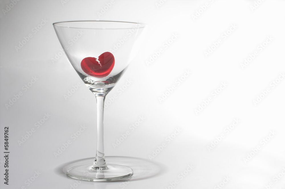 A broken heart drowning in a martini glass. A broken heart drowning in a martini glass.