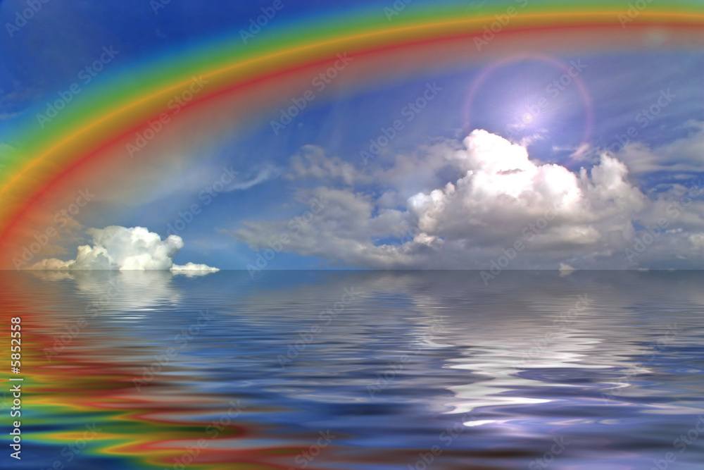clouds sky and rainbow in the ocean wih flare