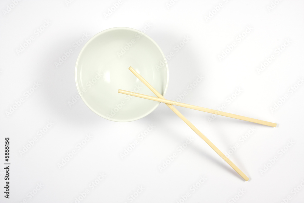 A bowl with chopsticks ready for rice or noodles. A bowl with chopsticks ready for rice or noodles.