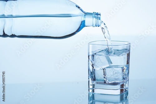pouring water into glass