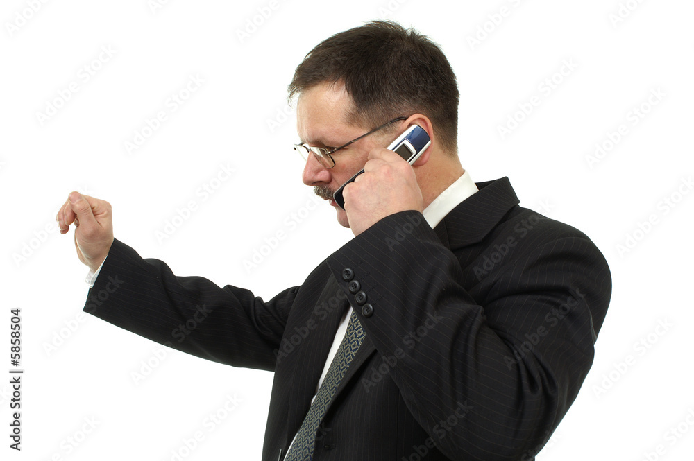 Businessman speaks by mobile phone isolated on white Businessman speaks by mobile phone isolated on white