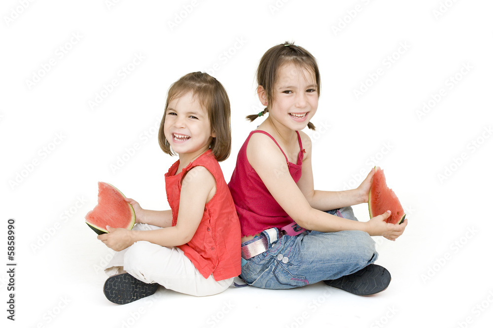little girls eating watermelon