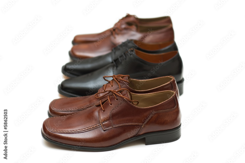 Three pairs of male shoes isolated on white Three pairs of male shoes isolated on white