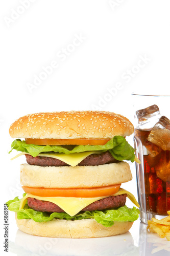 Double cheeseburger and soda, reflected on white background