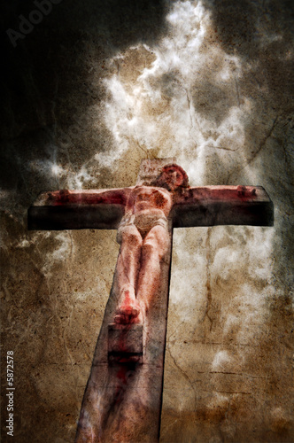 Jesus on the cross with stormy sky behind