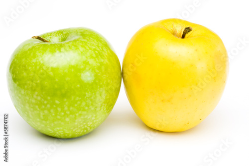 Fresh green and yellow apples at white background