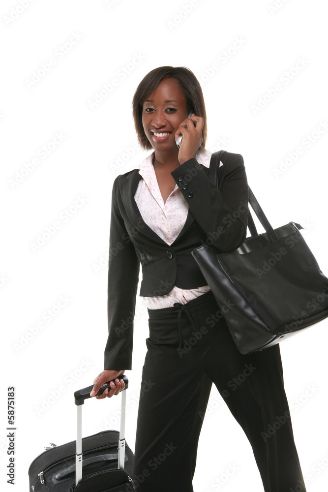 A pretty business woman travelling with her suitcase A pretty business woman travelling with her suitcase