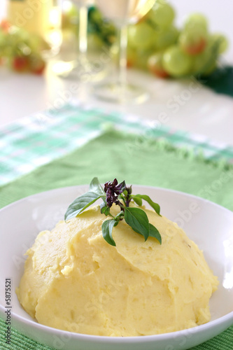Mash potato with basil heaped up and smoothed off