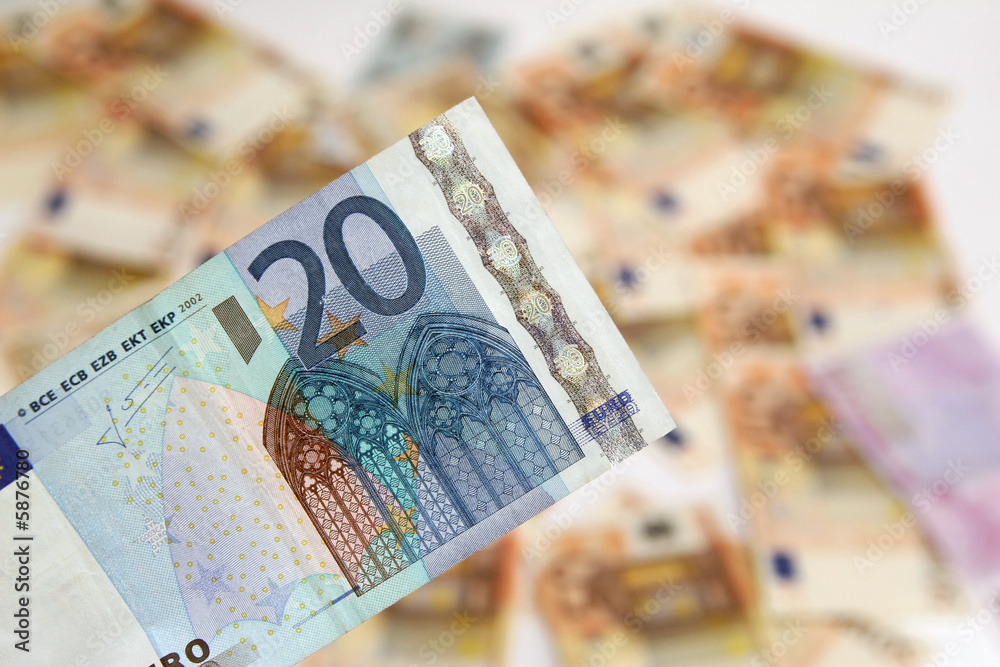 twenty euro banknote on background of money