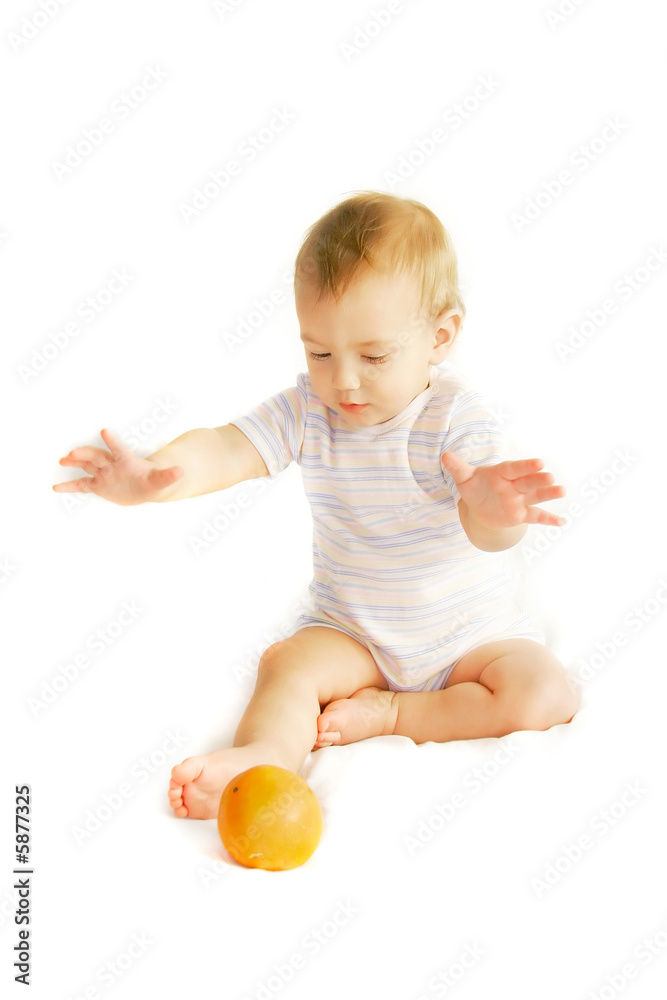 baby tryinh to catch an orange over white baby tryinh to catch an orange over white