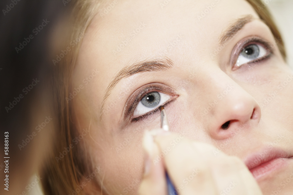 Eye - woman applying make up