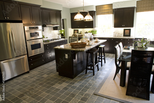 Kitchen with a tile floor and breakfast table.