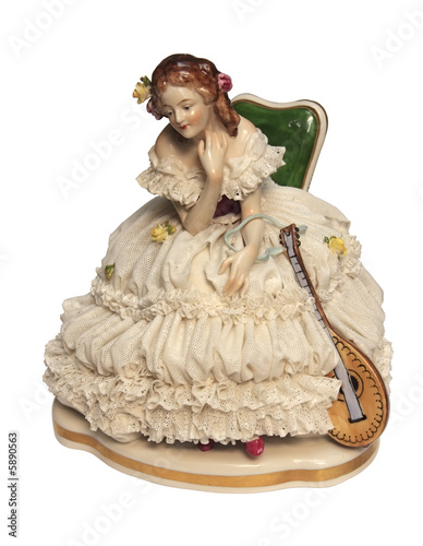 Romantic porcelain doll with a mandolin.