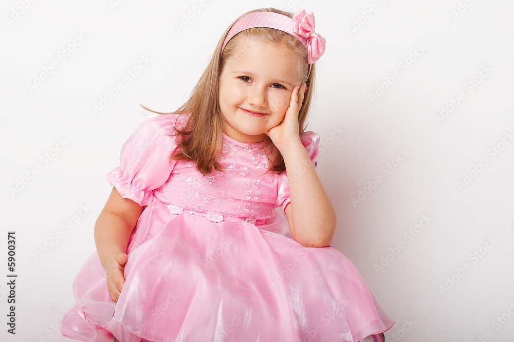Nice young girl in pink on light background Nice young girl in pink on light background