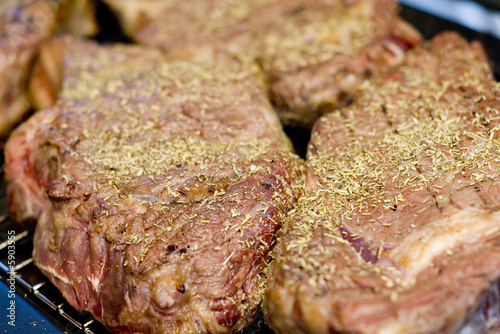 Cooking barbecue steak with herb and spice