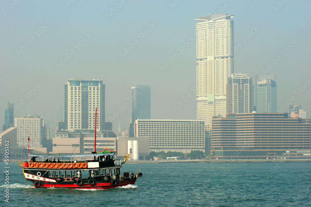 Fototapeta premium Tourist junk in Victoria Harbor, Hong Kong