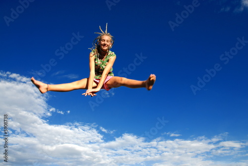 Girl jumping high in air