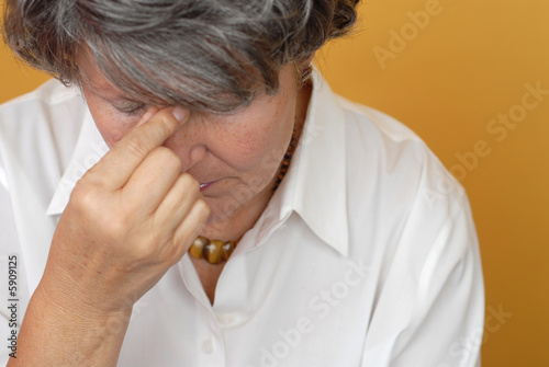 Sad and depressed older woman in pain