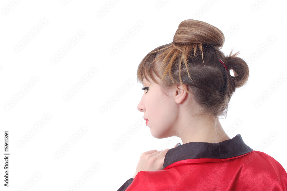 attractive girl in red kimono stay to turn the head backward. attractive girl in red kimono stay to turn the head backward.