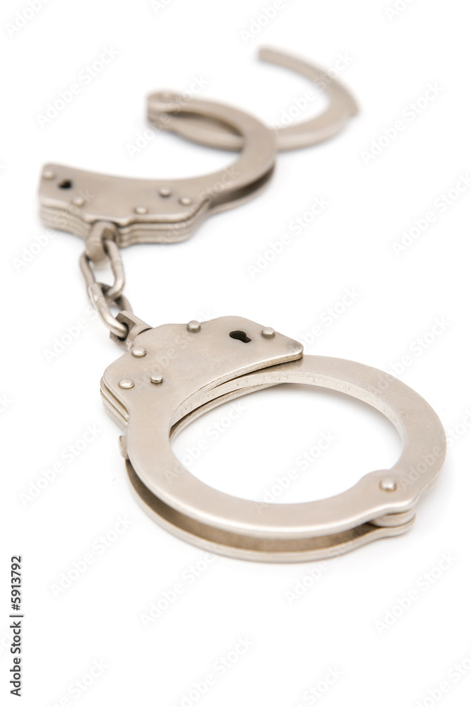 handcuff close up on white background, shallow dof handcuff close up on white background, shallow dof