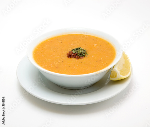 tomato soup with vegetables on white background