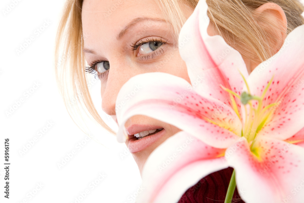 beauty portrait with a pink lily flower on white background