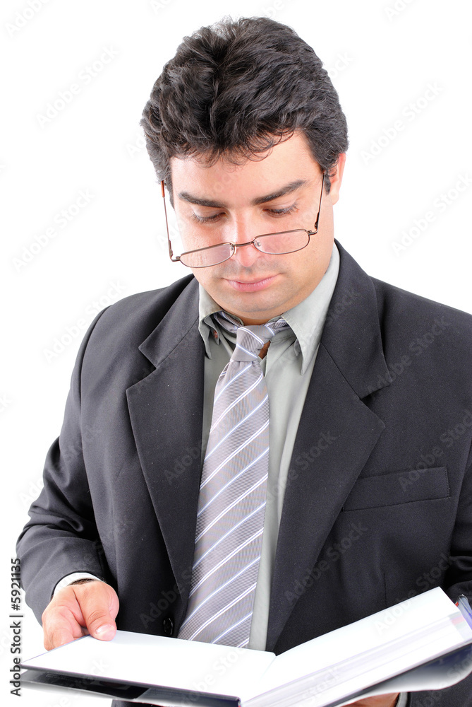 Young Man reading and holding a book . Young Man reading and holding a book .