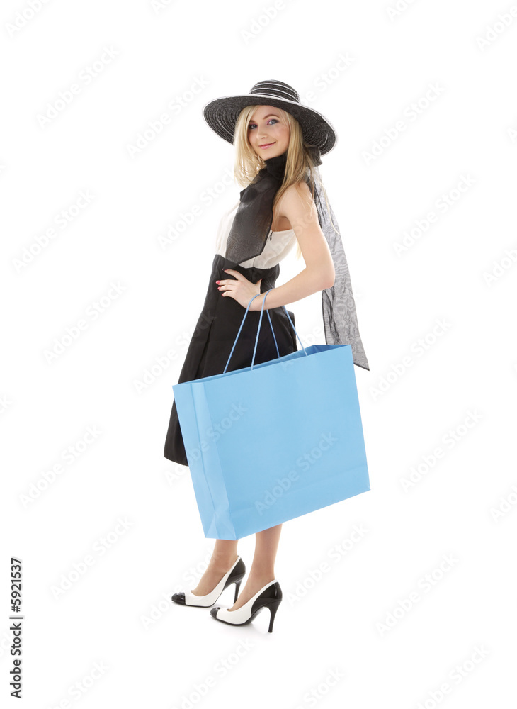 elegant blond in retro hat with blue shopping bag elegant blond in retro hat with blue shopping bag