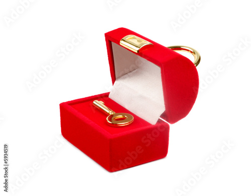 Decorative red box with key isolated over white background