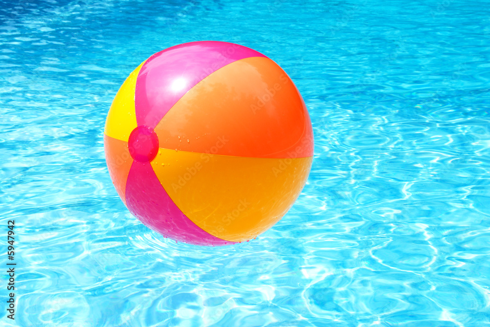 Colorful Beach Ball Floating on the Swimming Pool