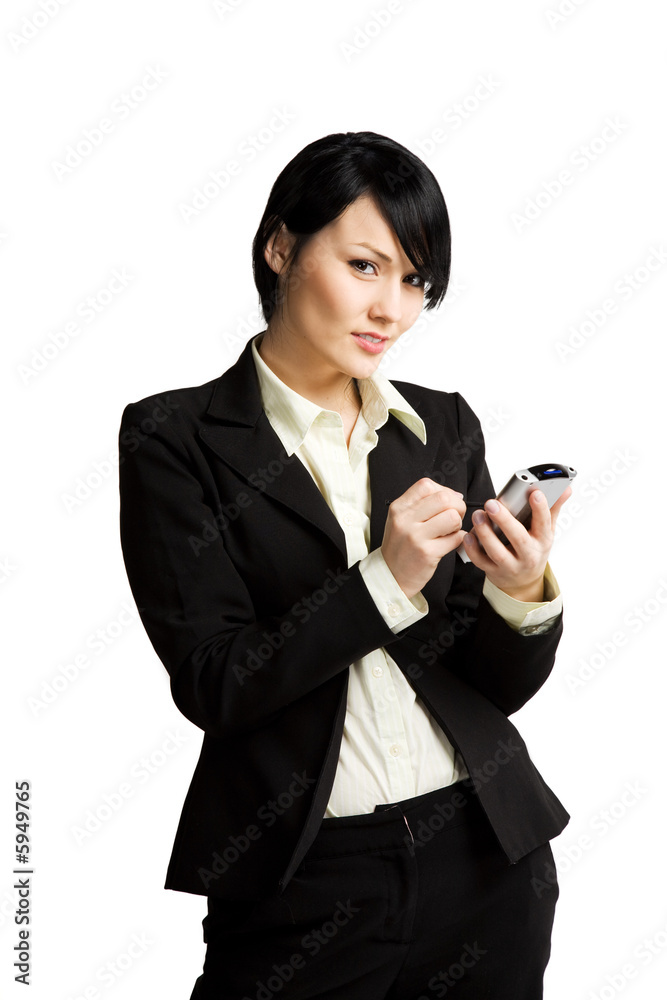 An isolated shot of a businesswoman working with her PDA An isolated shot of a businesswoman working with her PDA