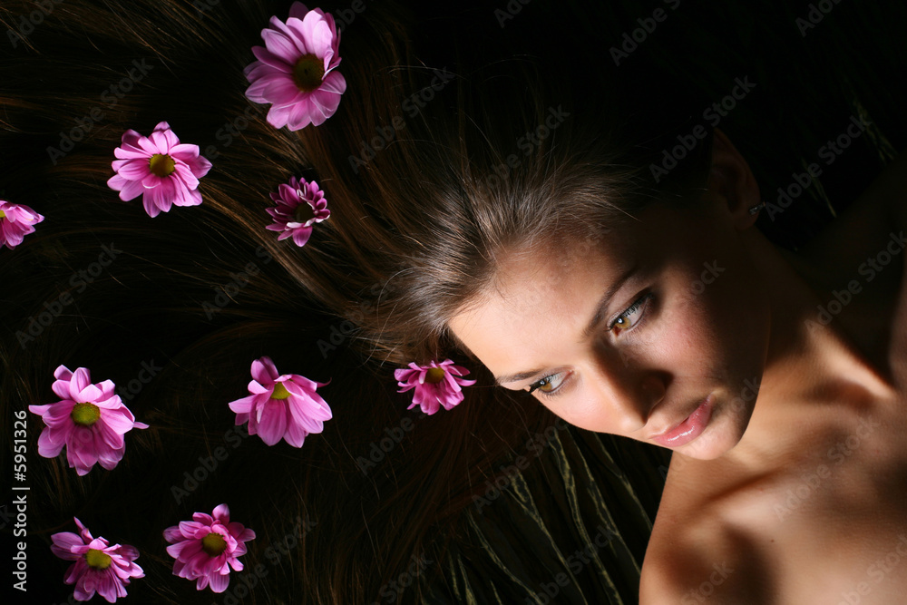 beautiful pink flowers in girl hair beautiful pink flowers in girl hair