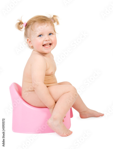 Pretty baby and pink potty . Isolate on white