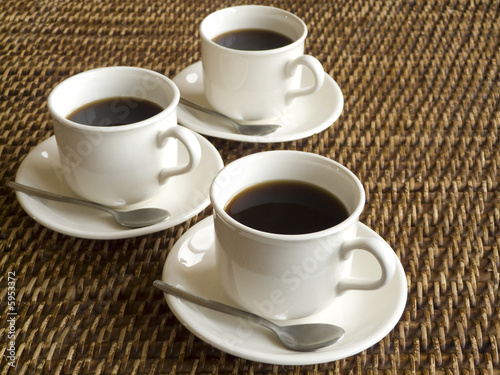 Three cups of coffee on a table