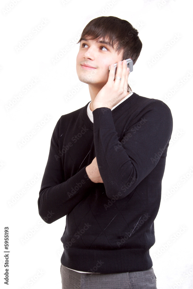 Young the man talks by a mobile phone Young the man talks by a mobile phone