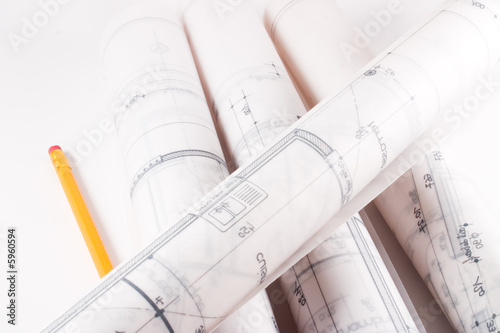 Plans of a house designed by an architect with a yellow pencil