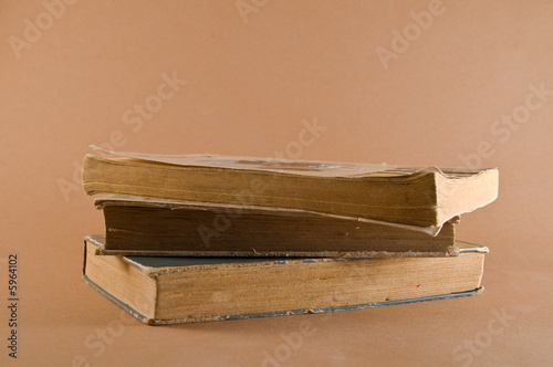 Three Old Books Piled Up