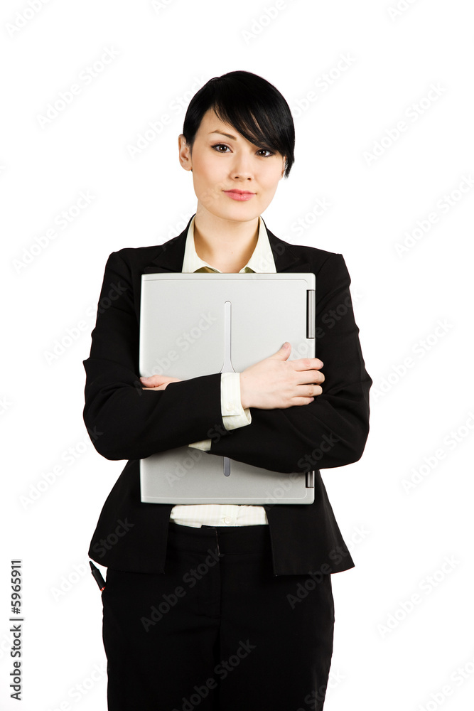 An isolated shot of a businesswoman carrying her laptop An isolated shot of a businesswoman carrying her laptop