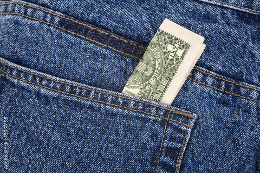 a blue jean and dollars close up shot a blue jean and dollars close up shot
