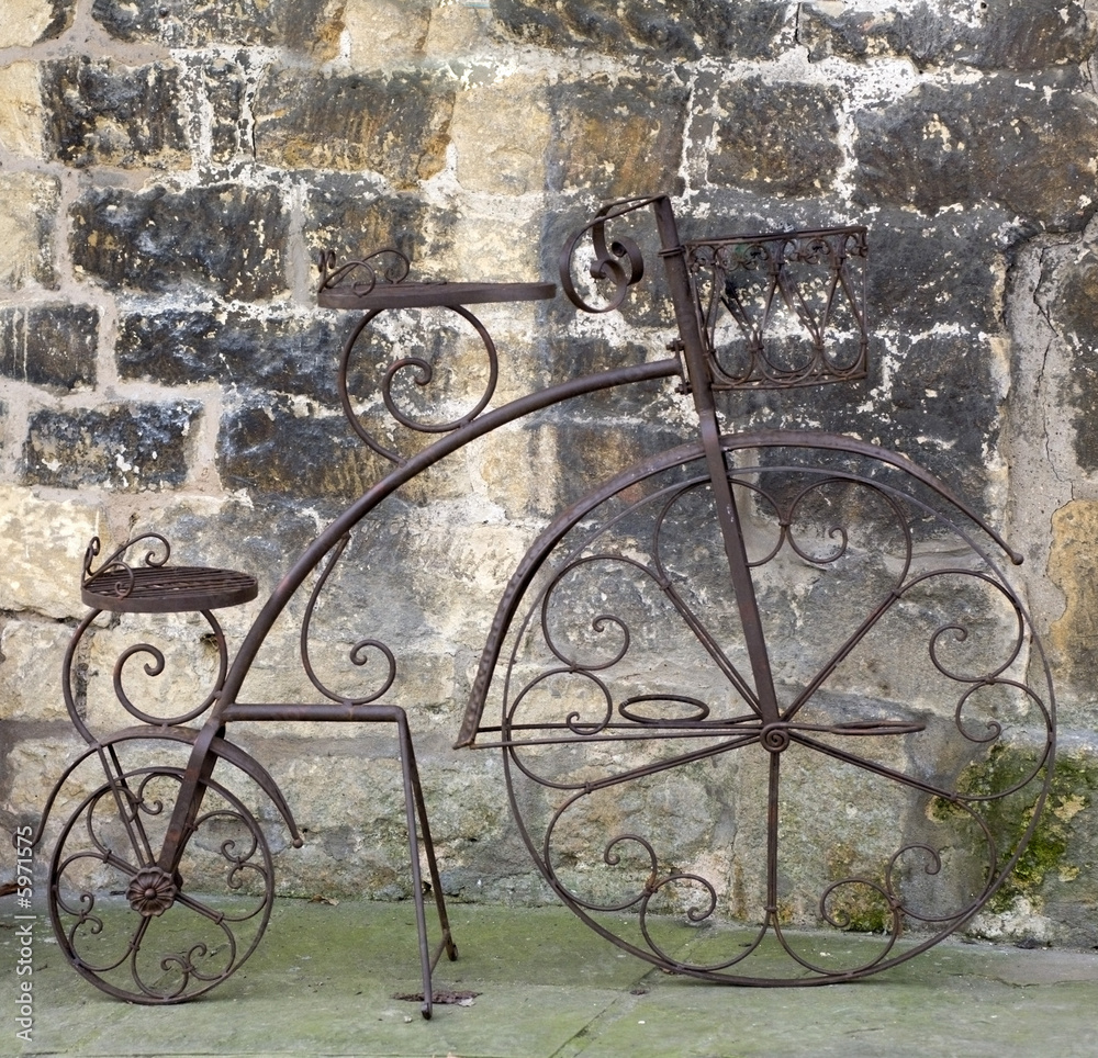 An old bicycle by the roadside.