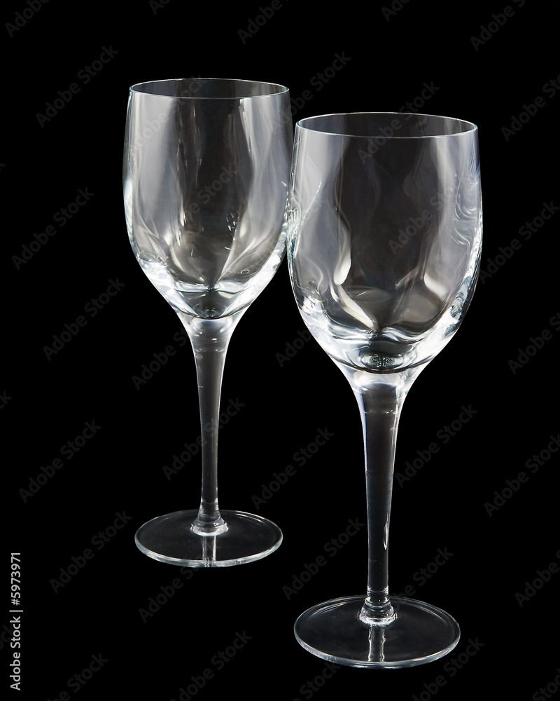 Two crystal wine glasses on dark background