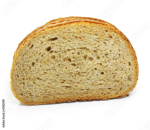 Cut of fresh baked bread isolated over white background