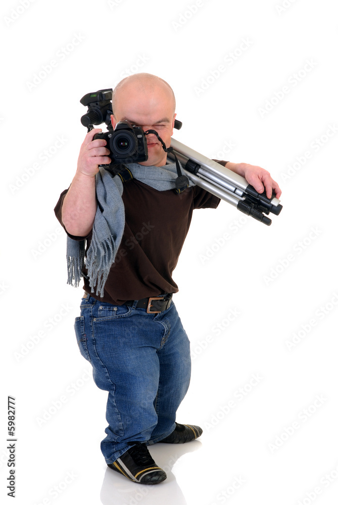 Little man, dwarf photographer with tripod and DSLR camera Little man, dwarf photographer with tripod and DSLR camera