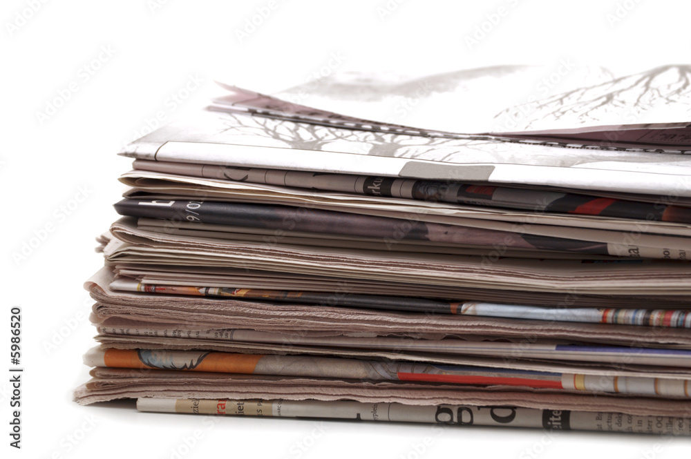 Stack of newspapers on white background Stack of newspapers on white background