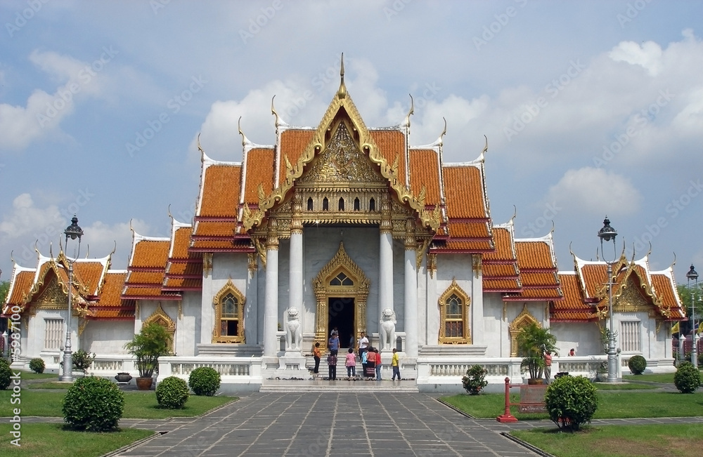 Budhist temple in Bangkok. People faces blured.